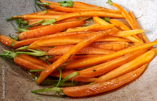 fried carrots in a pan. roasted vegetables