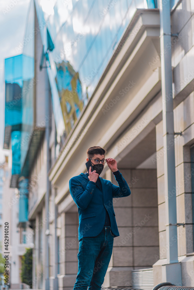 Urban guy wearing stylish clothing having phone conversation Urban guy wearing stylish clothing having phone conversation