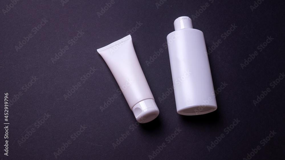 hand cream packaging on black background hand cream packaging on black background