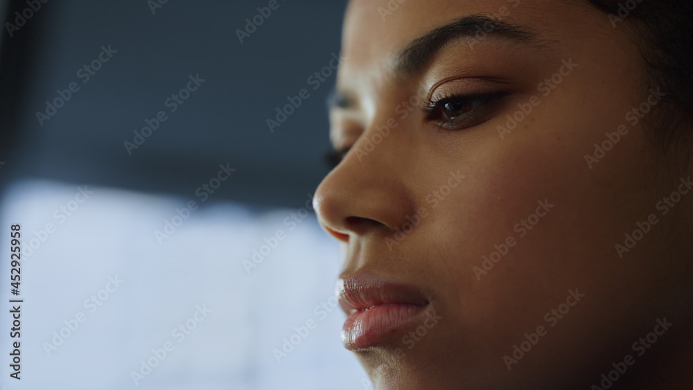 Businesswoman posing in office. Female professional face looking down Businesswoman posing in office. Female professional face looking down