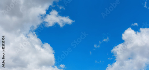 blue sky background with tiny clouds.