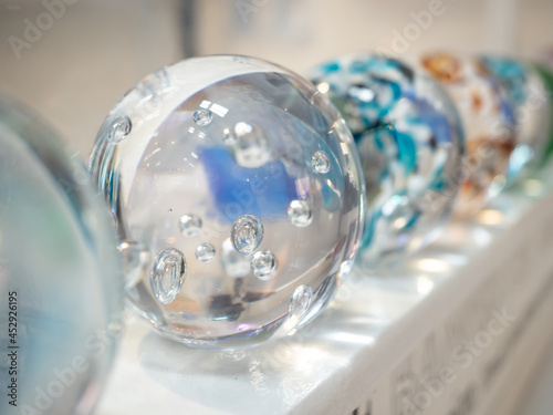 Decorative clear glass ball paperweight with bubble details photo