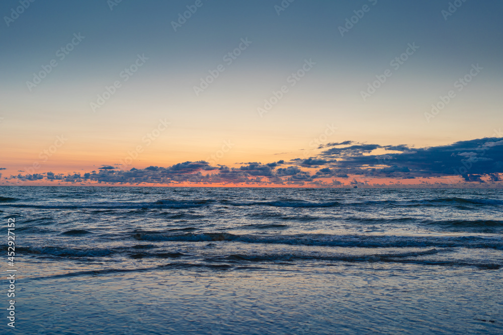 Sea at sunset with beautiful clouds
