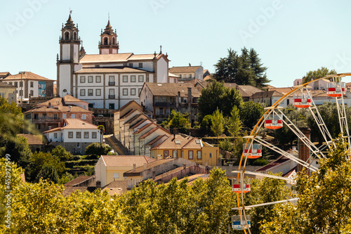 Tableau sur toile Viseu Cathedral in the background with the Ferris wheel at the São Mateus fair i