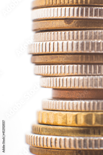 Coin stack isolated on white. Concept finance and accounting. Focus on coins edge