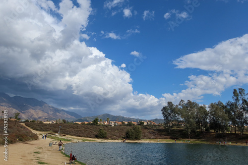 A Beautiful Blue Sky with Dramatic Puffy Clouds over a California Recreational lake
