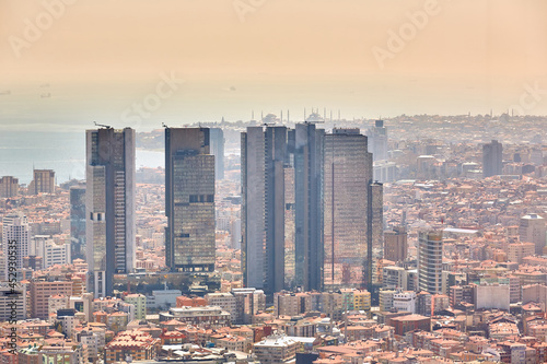 Urban landscape of European side of Istanbul and Bosphorus Strait on a horizon. Modern part of city with business towers of international corporations, skyscrapers and shopping malls of the city