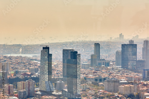 Istanbul, Turkey. Urban landscape of European side of Istanbul and Bosphorus Strait on a horizon. Modern part of city with business towers of international corporations, skyscrapers photo