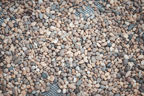 Pebble stones background placed on net decoration garden