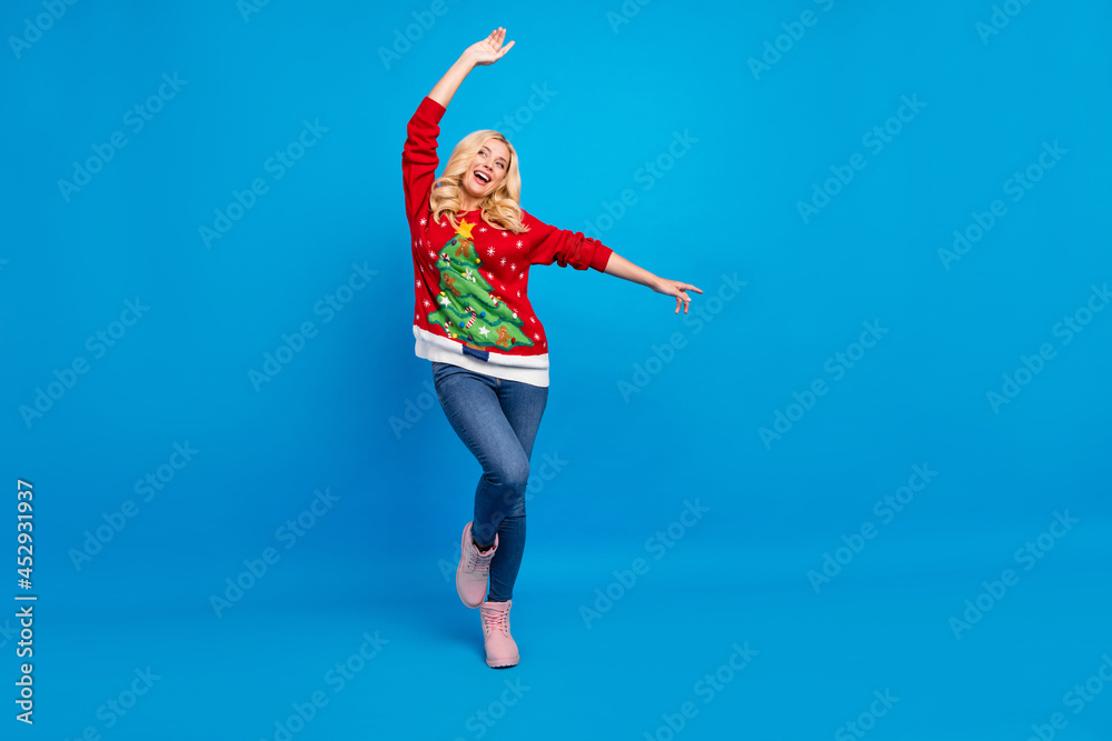 Full length body size view of pretty carefree cheerful wavy-haired girl dancing good mood isolated over bright blue color background Full length body size view of pretty carefree cheerful wavy-haired girl dancing good mood isolated over bright blue color background