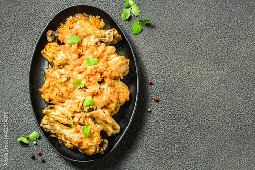 Homemade rustic chicken stew in cast iron skillet. Space for text, top view. photo