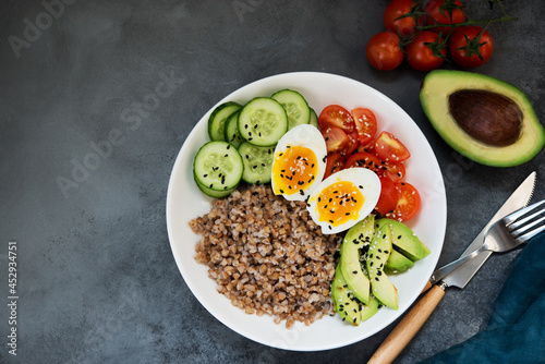Buddha bowl with vegetables, buckwheat tomatoes and avocado, healthy food, copy space