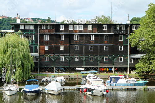 The old historic wooden building of the Czech Yachting Club by the river Vltava in Prague in Czech Republic. The sign on the roof means 