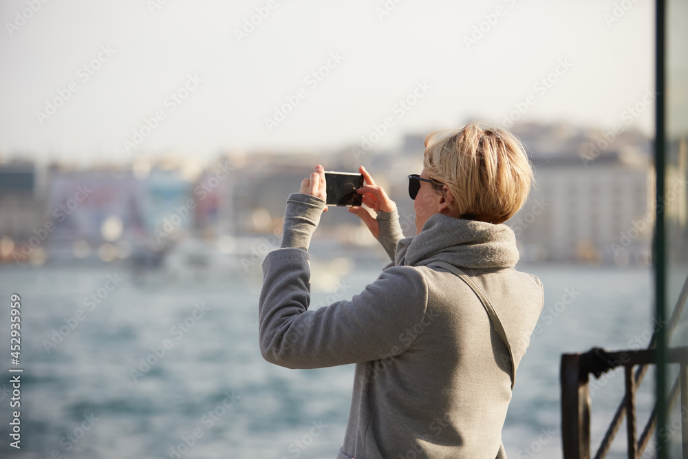 Pretty blonde taking a selfie on a spring day