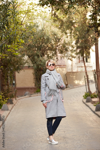 Young blond woman with sunglases on the street © sarymsakov.com