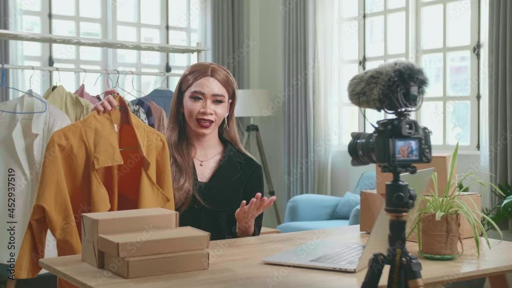 Young Asian Shemale Selling Clothes Online By Live Streaming. Selling It Online Live Streaming Concept Stock ビデオ | Adobe Stock