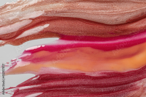 Liquid lipstick swatches isolated on white background. Pastel makeup brush stroke, smear, smudge. Red lip gloss swipe. Cosmetic product texture..