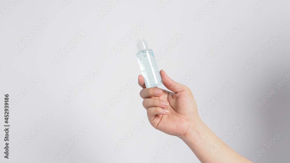 Hands is hold alcohol hand gel isoalted on white background. Hands is hold alcohol hand gel isoalted on white background.