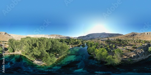 Gorgeous Gökpınar pond with its clear turquoise water and underwater plants in green nature, 360 VR Virtual reality angle aerial view. Sivas - Gürün TURKEY