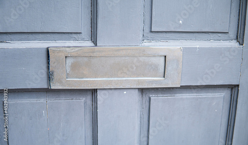 Obraz na płótnie Old letterbox in the door, traditional way of delivering letters to the house, old mailbox, correspondence
w salonie