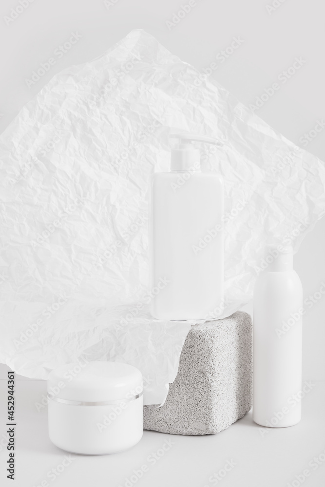a set of packaging for cosmetics, a blank jar and bottles with creams or lotions, mock up cosmetics product concept
