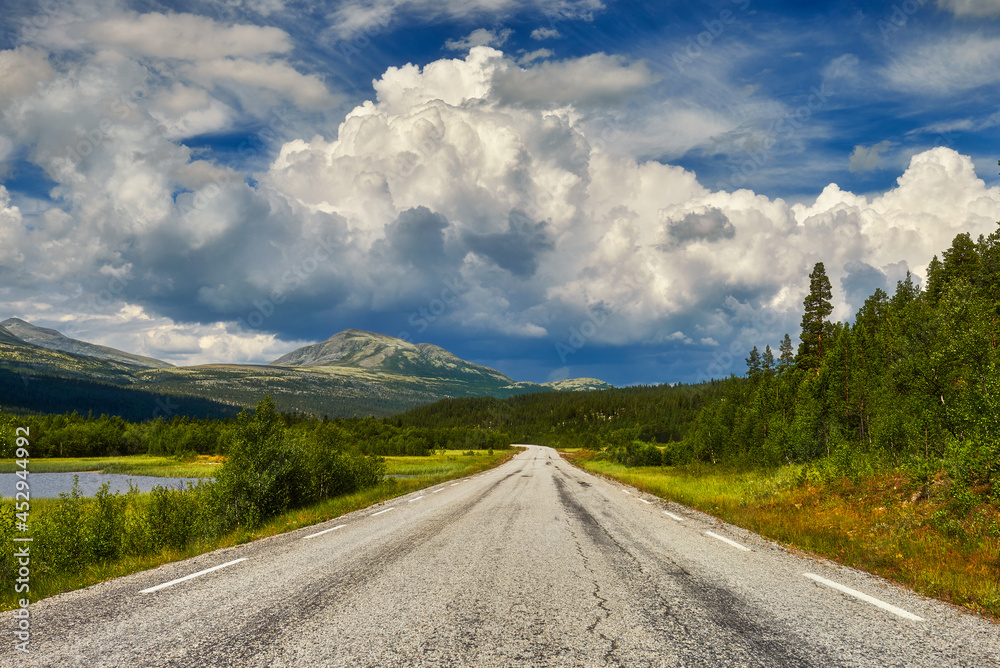 View of the road with mountains in depth, Norway around the village of Lom View of the road with mountains in depth, Norway around the village of Lom