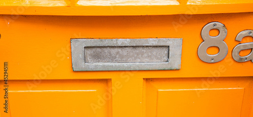 Obraz na płótnie Old letterbox in the door, traditional way of delivering letters to the house, old mailbox, correspondence
w salonie