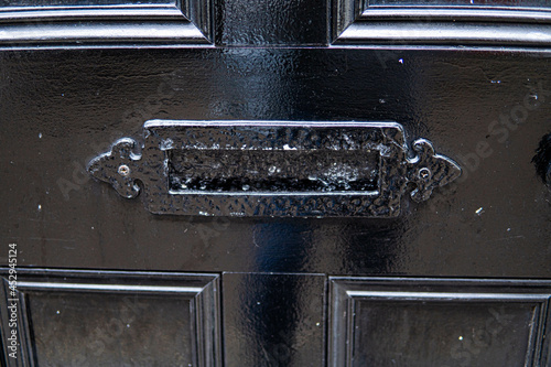 Obraz na płótnie Old letterbox in the door, traditional way of delivering letters to the house, old mailbox, correspondence
w salonie