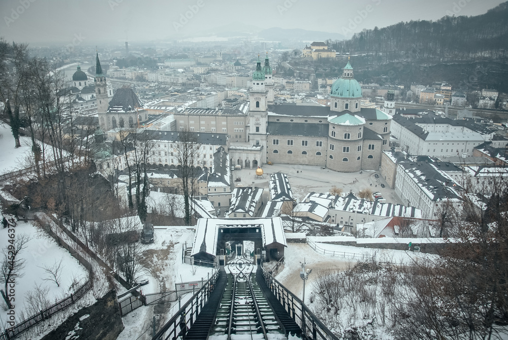 Naklejka premium View of winter Salzburg view of the city center salzburg austria winter river in salzburg