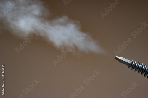 Картината върху платно Steam pressure cleaner plastic nozzle spraying water vapor cloud