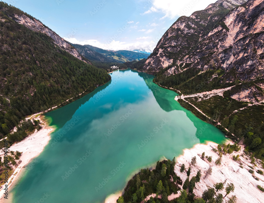 Drone view of Lake Braies (Pragser Wildsee) in the Dolomites of South Tyrol. Tourism direction to northern Italy. Bolzano Lago di Braies Italy