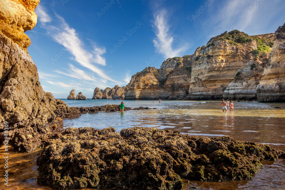 Beautiful beach of Dona Ana, located in Lagos - Algarve, Portugal. One of the most beautiful beaches of the Algarve - Portugal. Beach with huge cliffs and rocky formations in the ocean