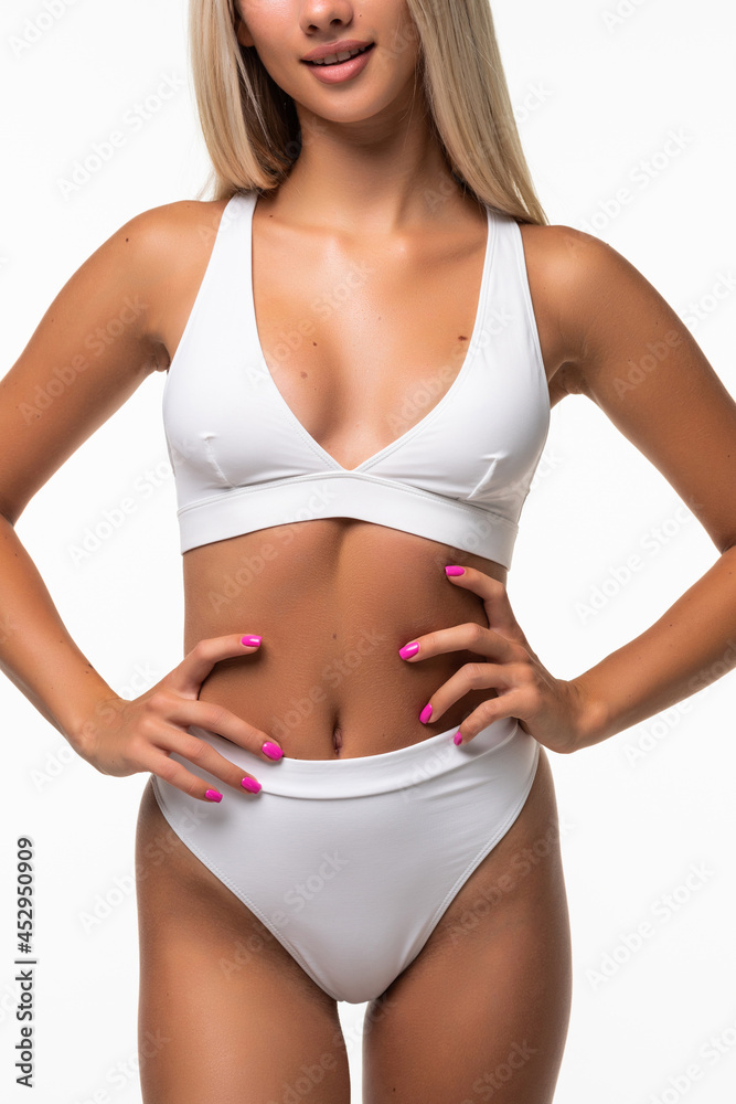 Portrait of happy beautiful fit woman on white background
