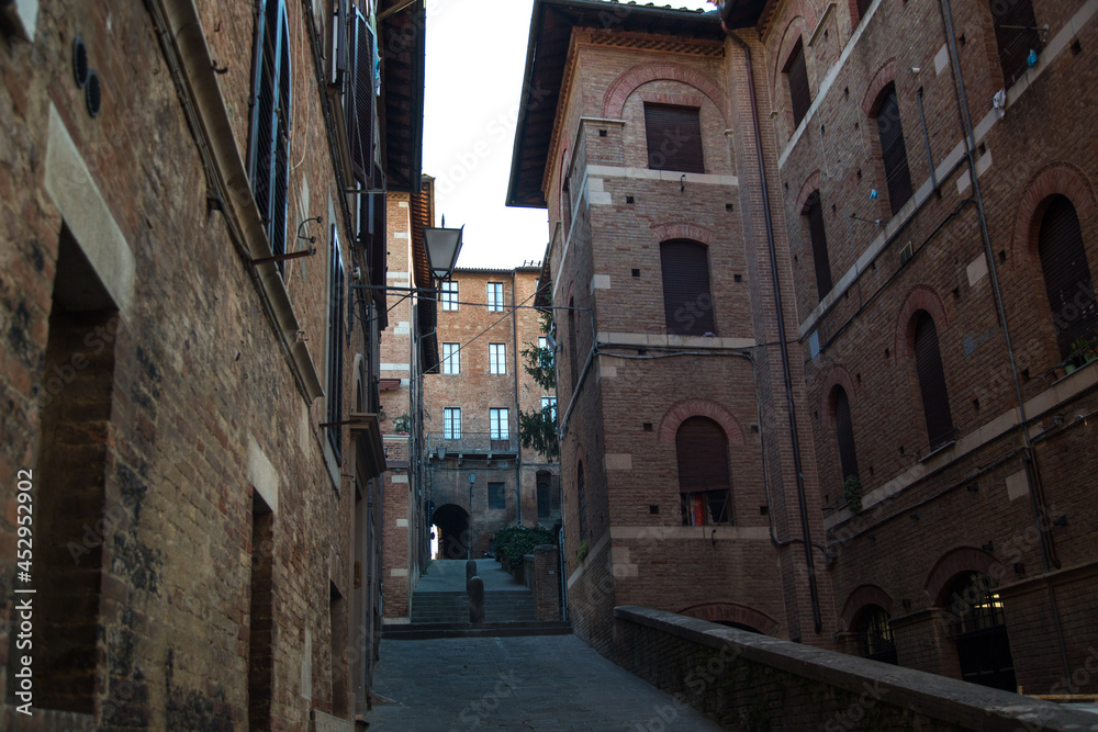 Romantic streets in the old Italian city of Siena historic town in Italian Tuscany