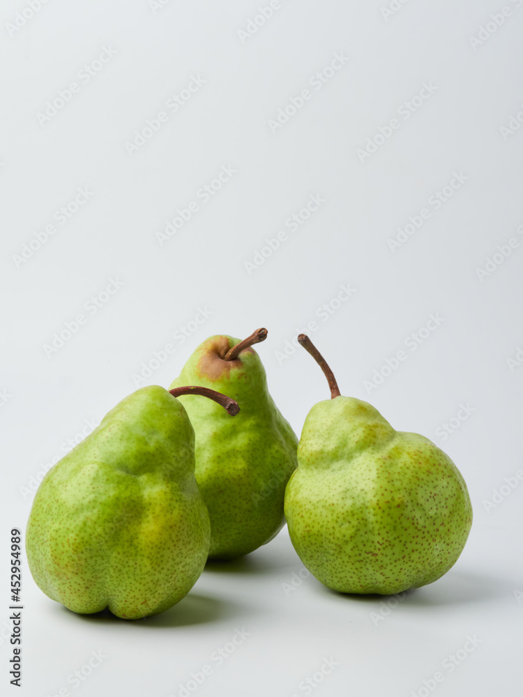 Green pear with a leaf isolated on white. Pear Clipping Path. Professional studio photo Green pear with a leaf isolated on white. Pear Clipping Path. Professional studio photo