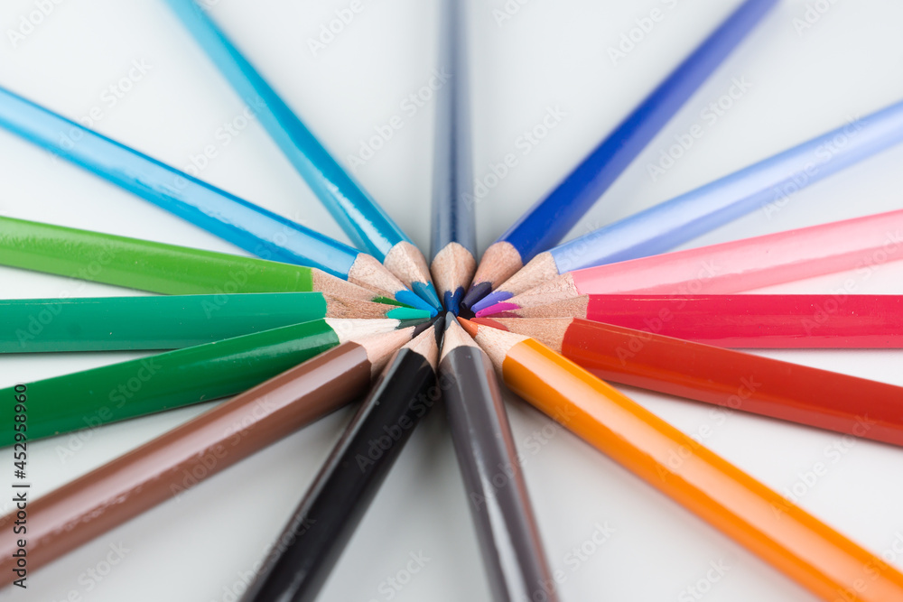 set of colored pencils lined by an arc set of colored pencils lined by an arc