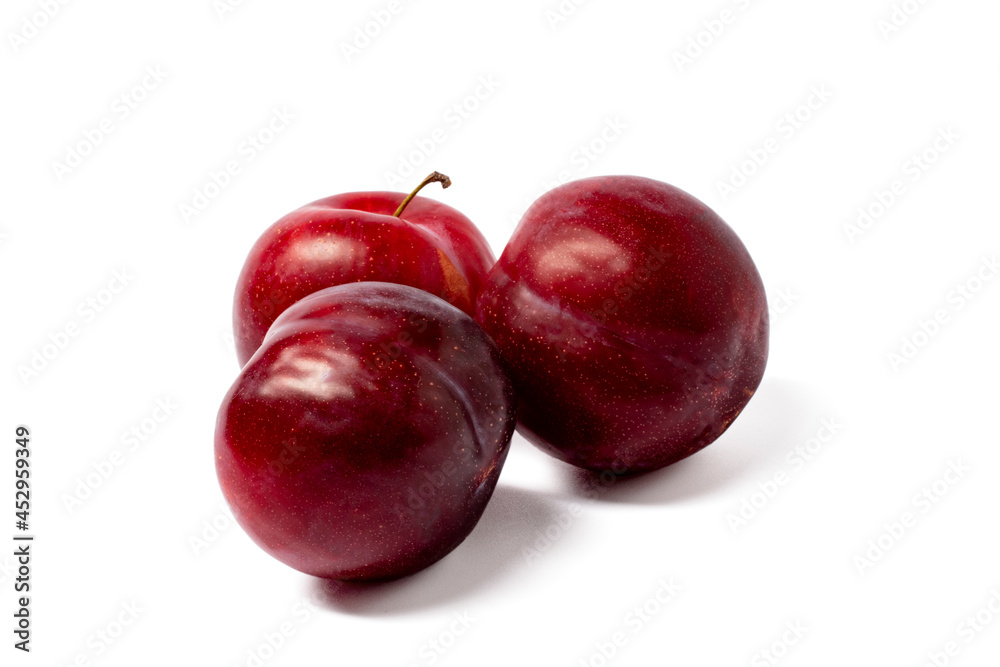 red plums isolated on white background
