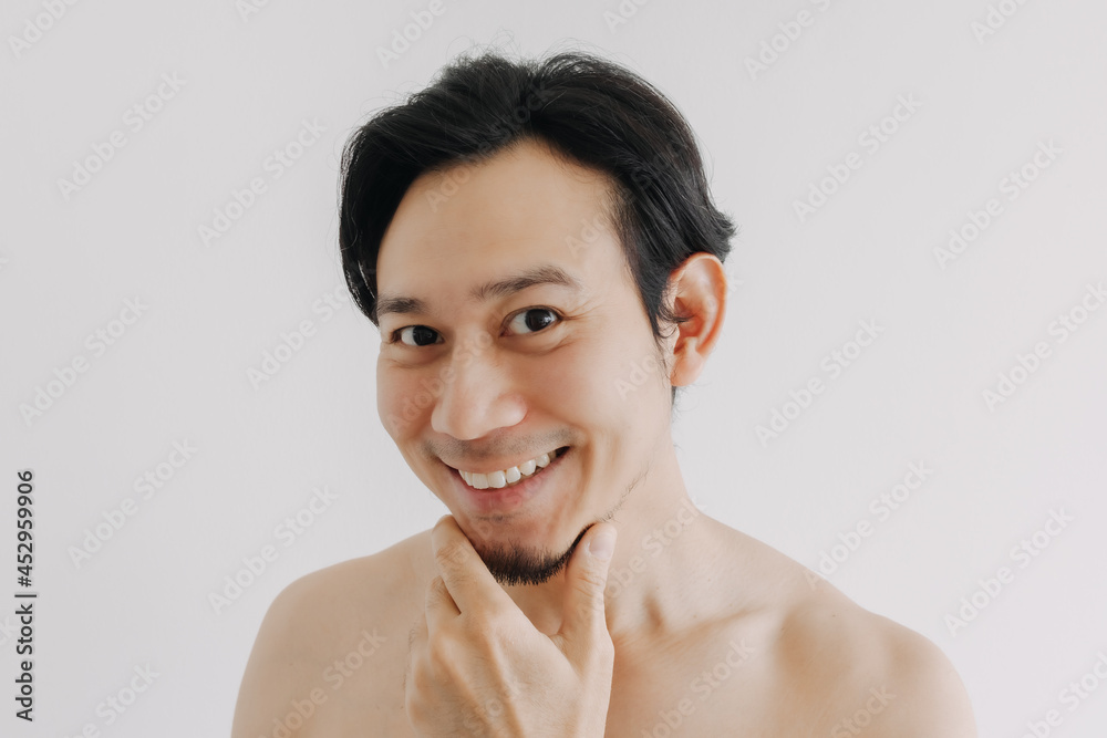 Obraz premium Happy Asian man face satisfied the skincare product applied on his face.