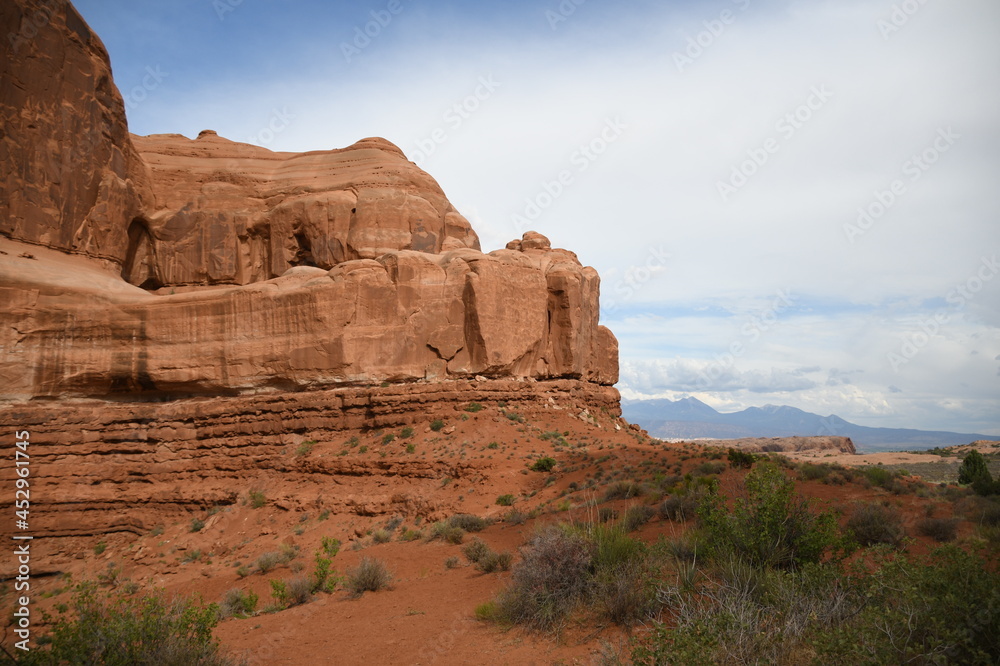 MONUMENT VALLEY RED ROCKS AND CLOUDY STORMY SKY IN MOAB UTAH MONUMENT VALLEY RED ROCKS AND CLOUDY STORMY SKY IN MOAB UTAH
