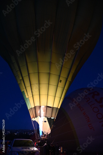 Hot Air balloon inflating in the darkness early morning Cappadocia Turkey