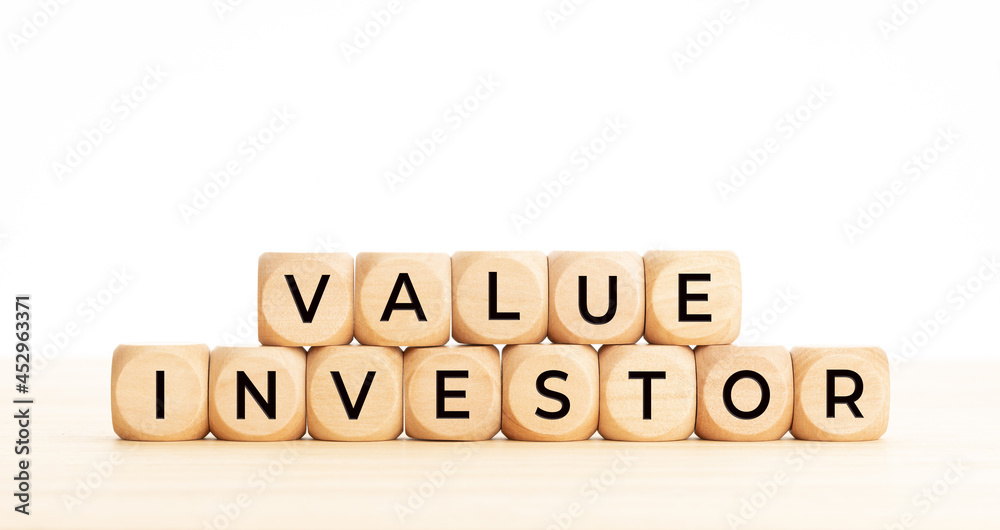 Value investor phrase on wooden block shape. Copy space. White background Value investor phrase on wooden block shape. Copy space. White background