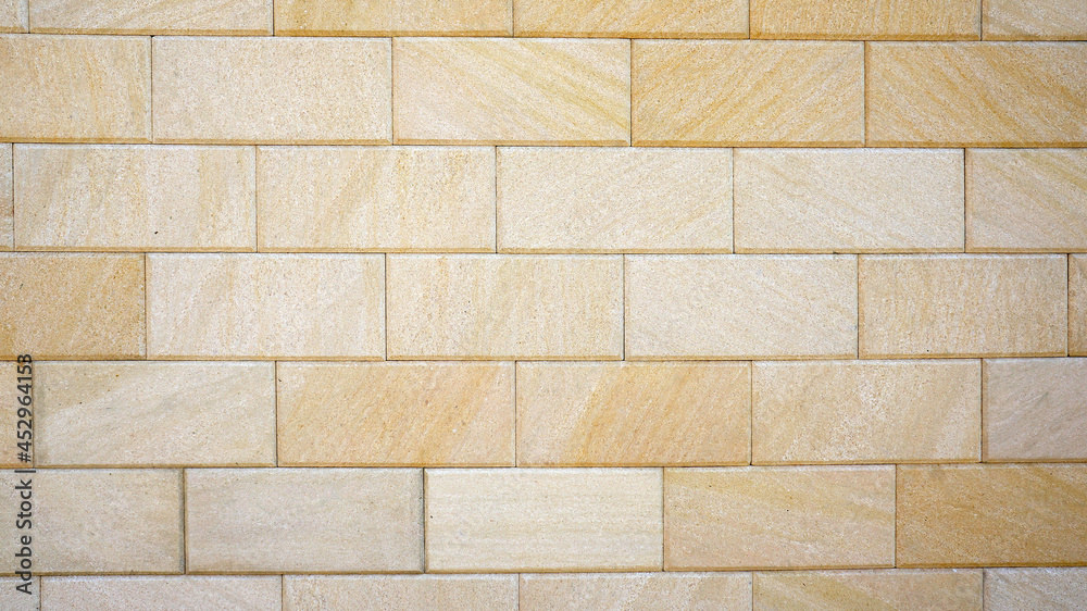 Brick wall. sawn stone wall. the wall of big yellow stone blocks Brick wall. sawn stone wall. the wall of big yellow stone blocks