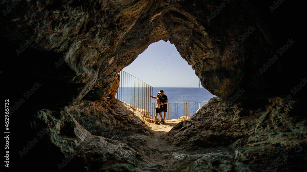 Couple going inside caves in Malta