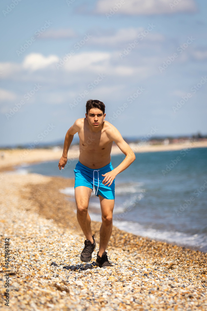 Running on a beach next to the sea