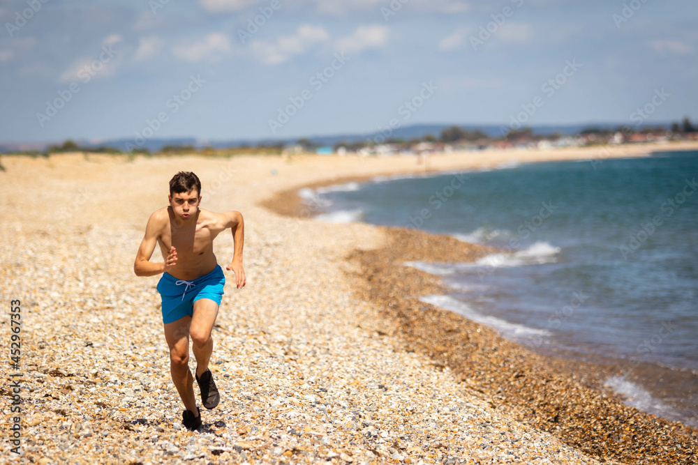 Running on a beach next to the sea