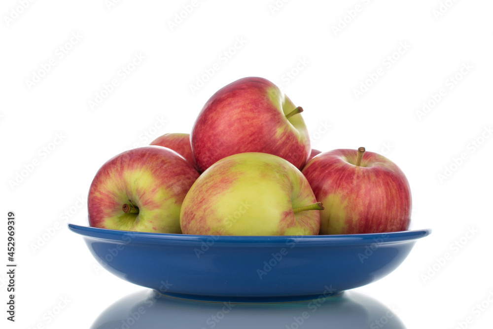 Several juicy organic apples with ceramic utensils, close-up, isolated on white. Several juicy organic apples with ceramic utensils, close-up, isolated on white.