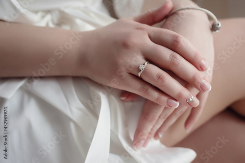 Beautiful portrait of bride in white dress at home.