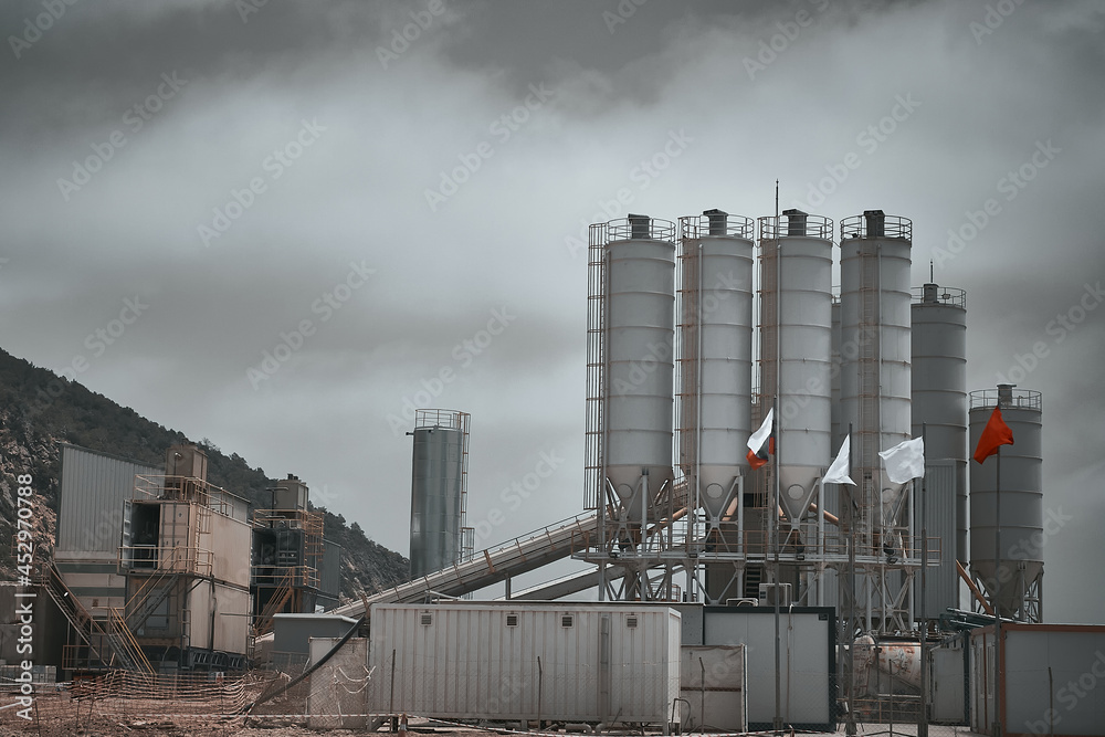 Obraz premium Concrete batching plant. Cement silos towers at construction site. Construction mixtures production