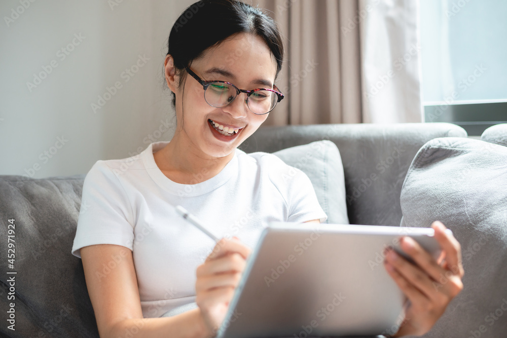 young female business woman work at home with tablet or laptop computer, using online communication technology, asian people in happy lifestyle, beautiful girl person stay at home young female business woman work at home with tablet or laptop computer, using online communication technology, asian people in happy lifestyle, beautiful girl person stay at home