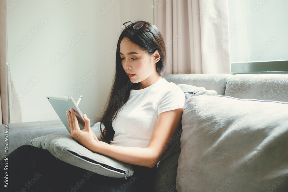 young female business woman work at home with tablet or laptop computer, using online communication technology, asian people in happy lifestyle, beautiful girl person stay at home young female business woman work at home with tablet or laptop computer, using online communication technology, asian people in happy lifestyle, beautiful girl person stay at home